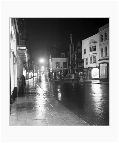 Street and general scenes at night in the city of Winchester, Hampshire. 1953