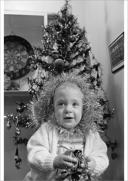 Meltham Fire Station Christmas party - young girl with tinsel wrapped round her head