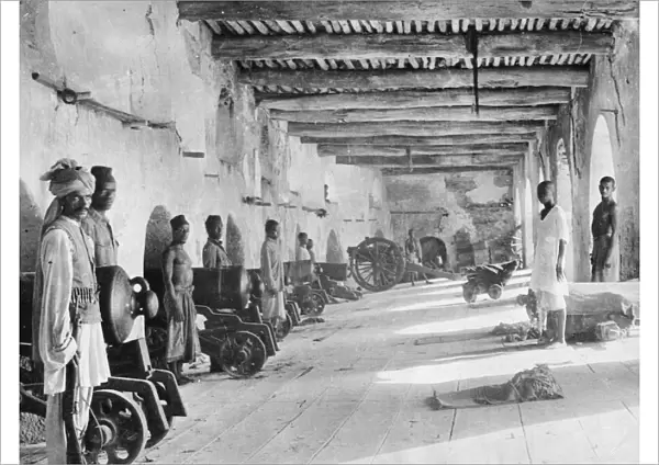 Arab soldiers seen here manning the gun battery at Fort Jelana at Muscat. Circa 1916