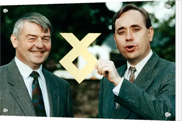 Doctor W. Allan Macartney and Alex Salmond with the SNP logo. 18th September 1991