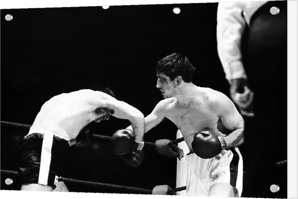 Boxing match between Jimmy Tibbs (white shorts) v Franco Macchia