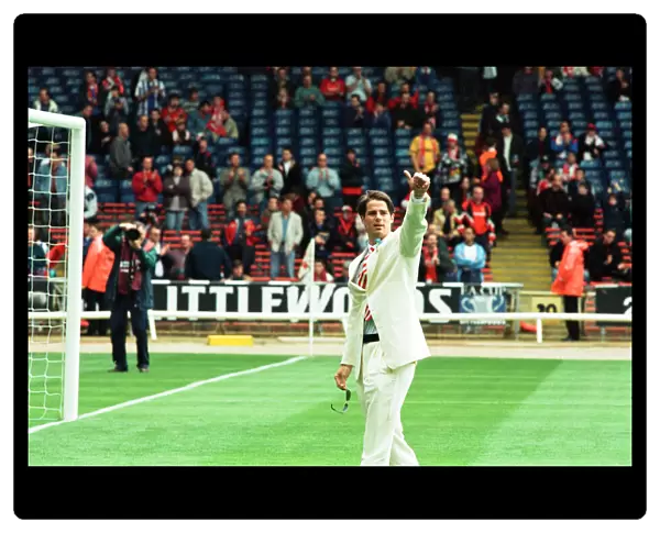 Jamie Redknapp waves to the crowd during the pre-match festivities at Wembley for