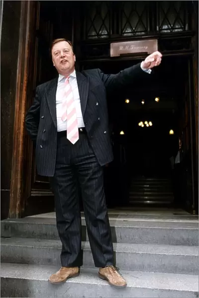 Kenneth Clarke MP Standing outside the treasury Dbase