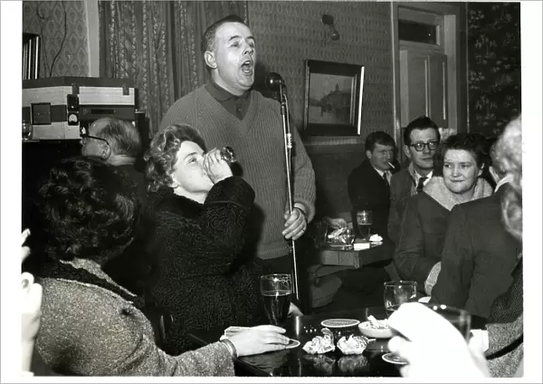 Pub singer paraffin lamp pub bar Glasgow Scotland 1961 Scotland archive