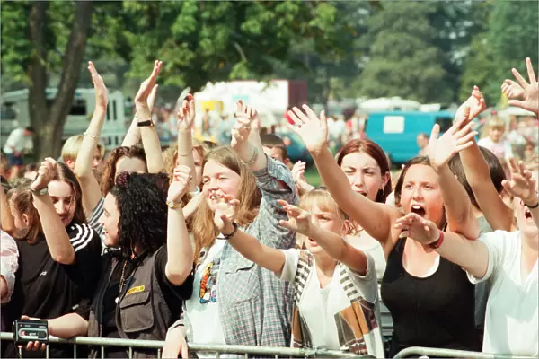 Fans of Peter Andre, cheer as he performs at Fun Day, Stewart Park, Marton, Middlesbrough