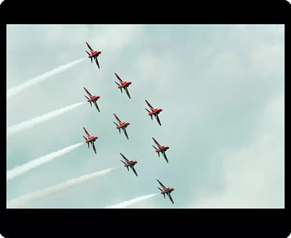The Red Arrows, RAF Aerobatic Team, performing at the 1993 500 CC British Motorcycle