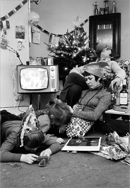 A typical family scene around the television on Christmas day