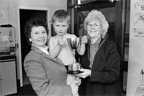 Water baby William receives his trophy from the Mayoress (left) and Deputy Mayoress