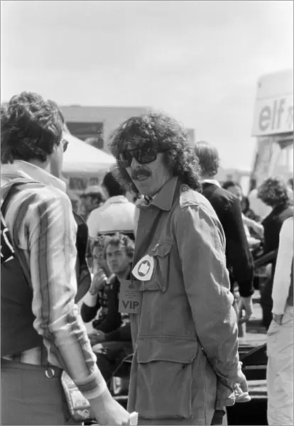 George Harrison at the British Grand Prix motor racing qualifying sessions at Silverstone