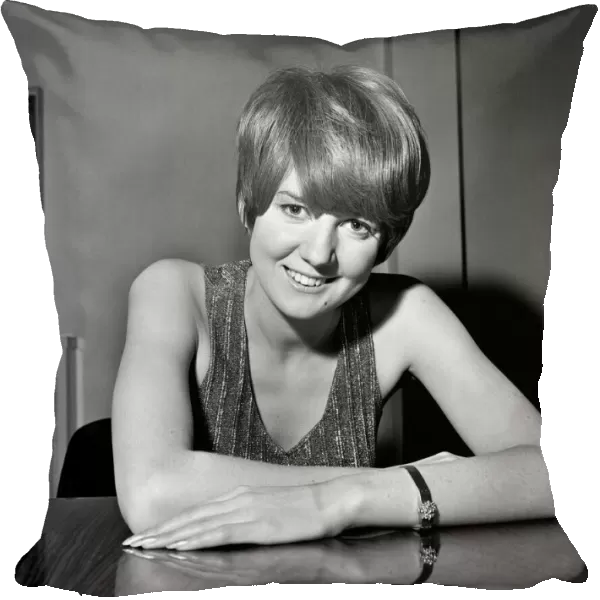 Cilla Black relaxes between shots at the filming of The Beatles spectacular at Granda TV