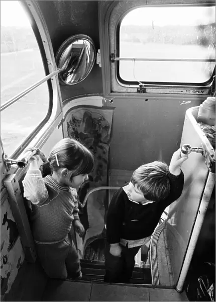 Children play on Woosehill Play Bus, a 1949 vintage bus, pictured 14th January 1986