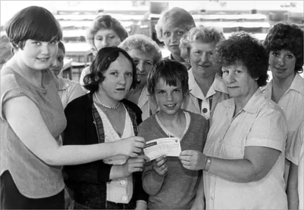 Workers at the Dewhirst shirt factory, Dormanstown, hand over £