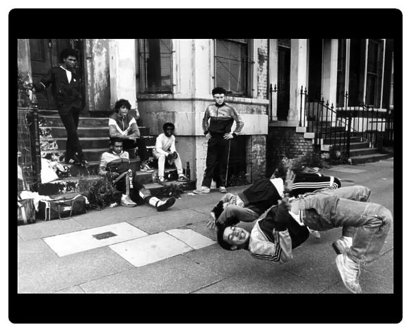 A group of breakdancers, the Eastwood Rockers, going through their break dancing paces