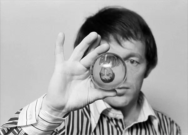 Magician Paul Daniels with a crystal ball. 1st February 1978