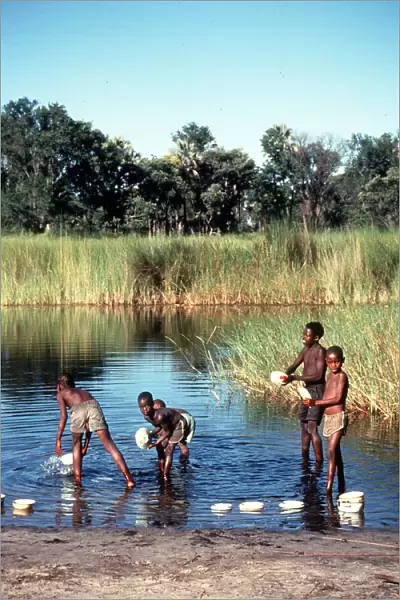 Botswana children wash in the Okauango Delta Msi