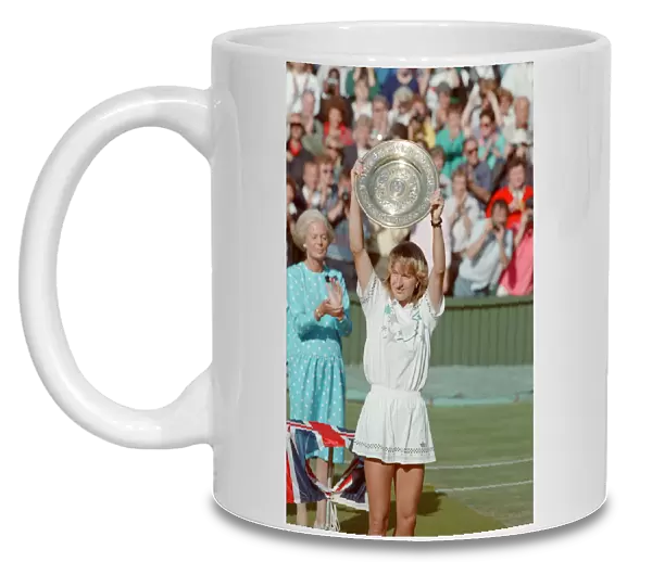 Steffi Graf pictured with her trophy, the Venus Rosewater Dish