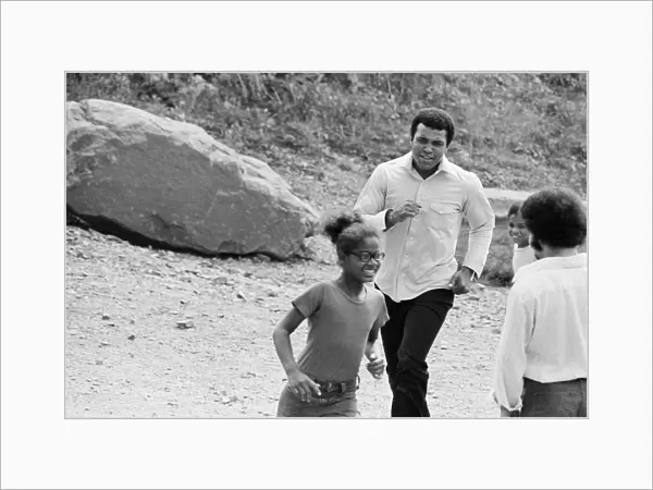 Muhammad Ali chasing a little girl at his training camp in Pennsylvania