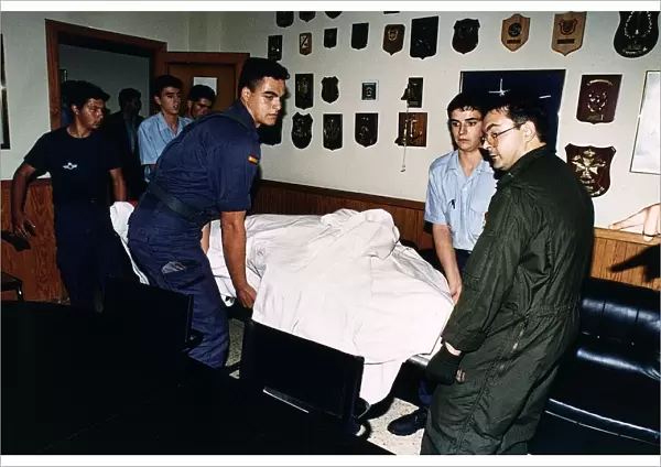 Robert Maxwells body being carried on a stretcher