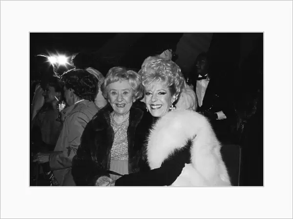 The cast of Coronation Street attend a party. Doris Speed and Julie Goodyear