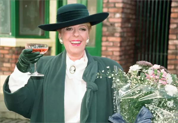 Julie Goodyear is pictured outside The Rovers Return on the set of Coronation Street