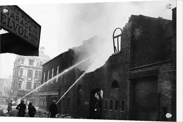 Firemen dampening down Mateer & Nelson on Chapel Street