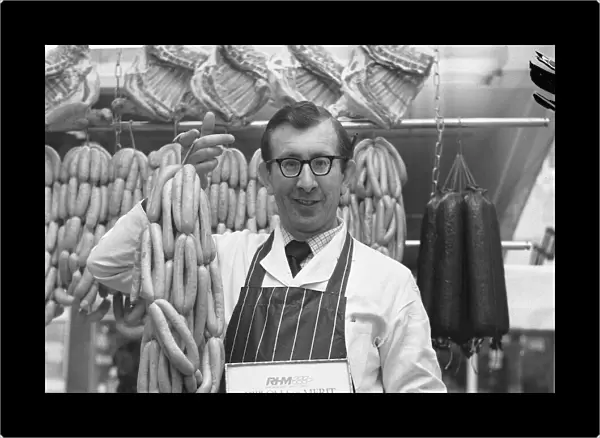 Robert Thompson Dix in his North Tyneside shop holds a string of sausages