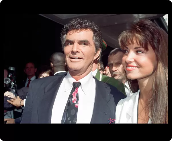 American actor Burt Reynolds opening the Harrods Sale. Pictured with Miss UK Claire Smith