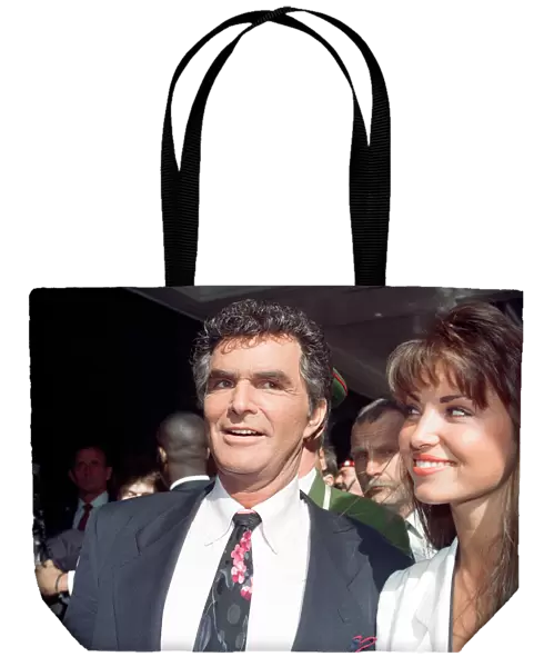 American actor Burt Reynolds opening the Harrods Sale. Pictured with Miss UK Claire Smith