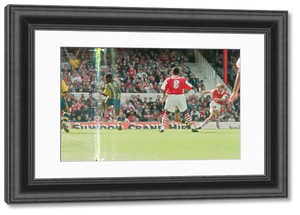 Dennis Bergkamp scores his first ever goal for his new club Arsenal