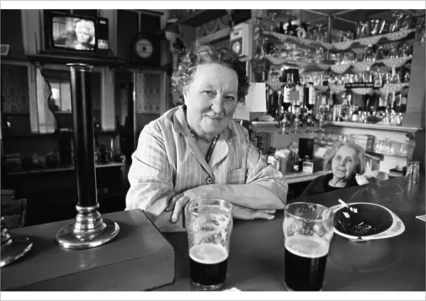A woman working in a pub in Salford, Manchester, 16th July 1974