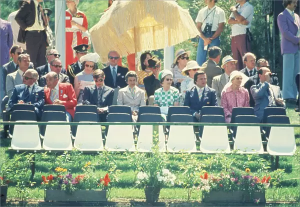 Queen Elizabeth II (4th from the right in the green and white outfit