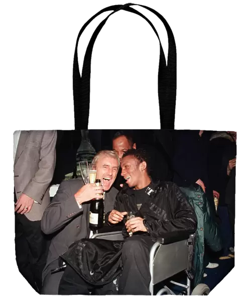 Musician Tricky, in a wheelchair pictured with another guest at the Brit Music Awards at