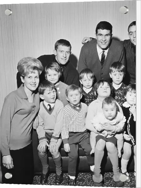 Liverpool footballers Ron Yeats and Ian St John pose with their children