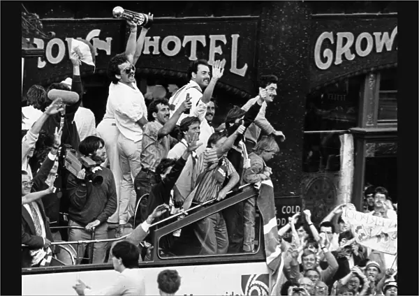 Liverpool celebrate their League Championship title success as they parade the trophy to