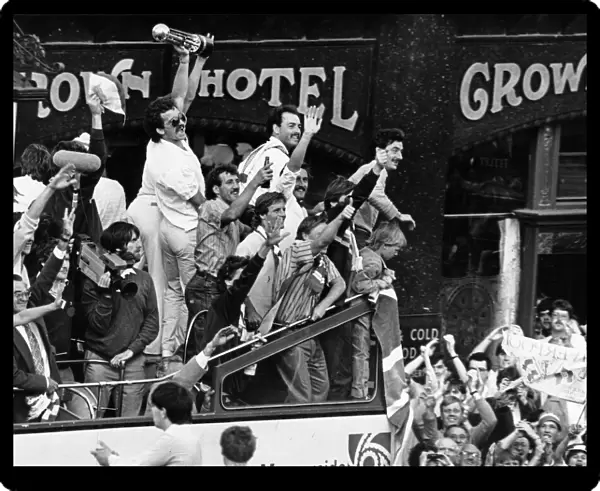 Liverpool celebrate their League Championship title success as they parade the trophy to