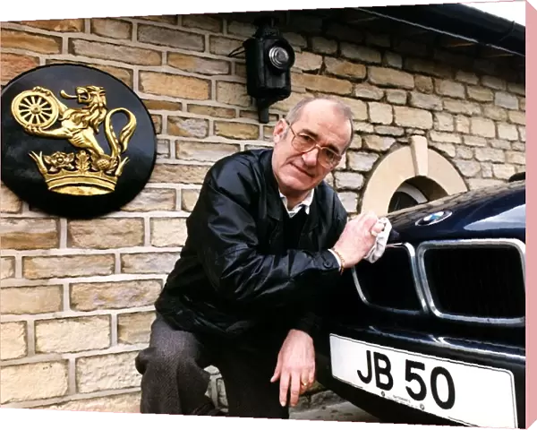 Jim Bowen Comedian  /  TV Presenter polishing his BMW car