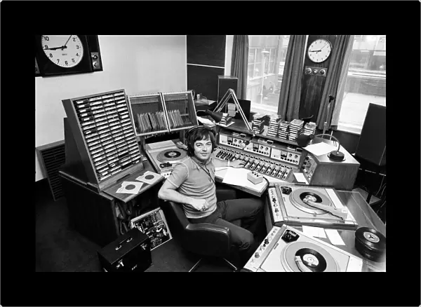 BBC Radio Disc Jockey Tony Blackburn pictured in the studio. 21st June 1973