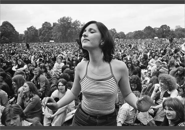 Picture shows a fan dancing amongst the huge audience at London Hyde Park for a concert