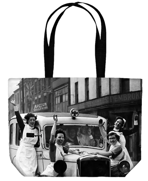 Jubilant nurses celebrate VE-Day in Liverpool. 8th May 1945