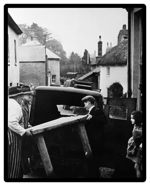 Slapton butcher moving the contents of his shop prior to completion of the evacuation of