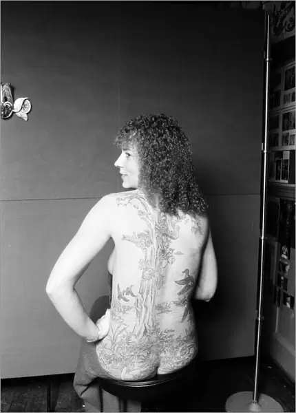 Connie Cunningham shows off her tattooed back. 28th October 1981