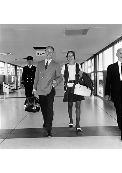 Footballer Bobby Charlton and his wife Norma leaving Heathrow Airport for Australia