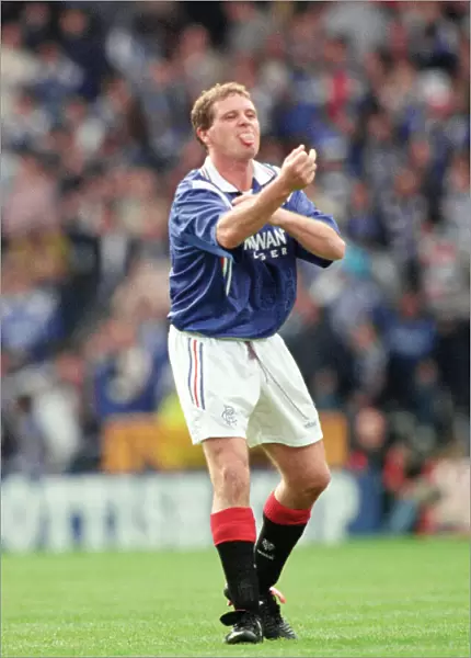 Glasgow Rangers footballer Paul Gascoigne making a one finger gesture while sticking out