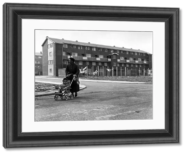 A woman and child walking in Butetown, Cardiff. 5th May 1961