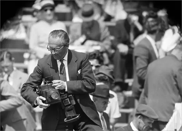 A photographer at Derby Day at Epsom. 3rd June 1959
