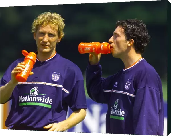 England footballers Robbie Fowler (right) and Ray Parlour during a training session at