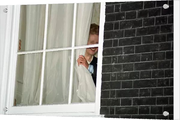 Margaret Thatcher watches John Major from a window at 10 Downing Street after he won