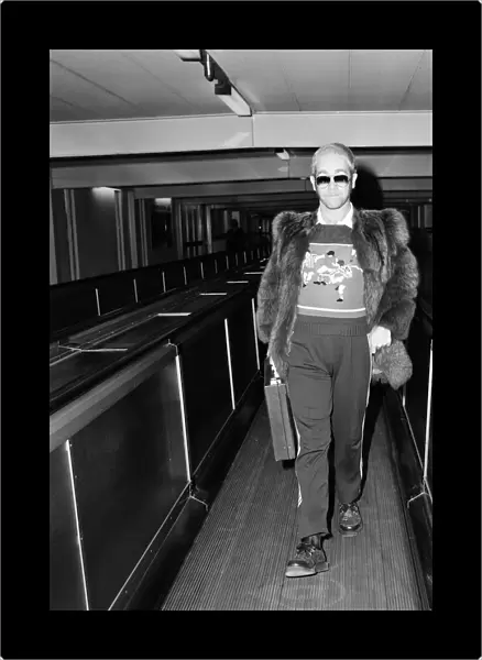 Elton John, flies off to Toronto, Canada from Heathrow Airport, London