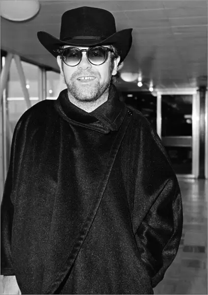 Elton John at Heathrow Airport for a flight to New York. 11th January 1981