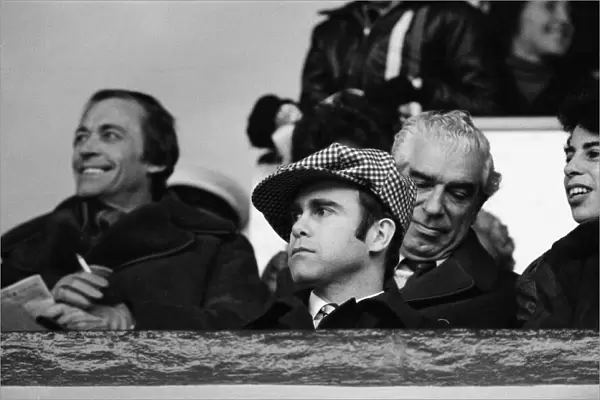 Elton John watching the West Ham United v Watford football match. 7th January 1978